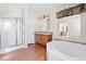 Bright bathroom featuring a jacuzzi tub, walk-in shower, and double sink vanity at 1816 Grimball Rd, Charleston, SC 29412
