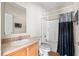 Standard bathroom featuring a shower-tub combo, vanity sink, and light wood cabinetry at 1816 Grimball Rd, Charleston, SC 29412