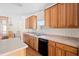Well-equipped kitchen with abundant counter space, wooden cabinets, and a dishwasher at 1816 Grimball Rd, Charleston, SC 29412