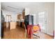 Kitchen eat-in area with black refrigerator, wooden cabinets, and breakfast table near the door at 1816 Grimball Rd, Charleston, SC 29412