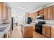 Functional kitchen with warm wood cabinetry, a kitchen island, and modern appliances at 1816 Grimball Rd, Charleston, SC 29412