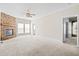 Open living room featuring a stone fireplace, neutral walls, and carpeted floors at 1816 Grimball Rd, Charleston, SC 29412