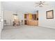 Spacious living area with a ceiling fan, carpet flooring, and open access to dining at 1816 Grimball Rd, Charleston, SC 29412