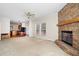 Spacious living room with a ceiling fan, carpeted floors, and a floor-to-ceiling stone fireplace at 1816 Grimball Rd, Charleston, SC 29412