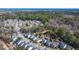 Neighborhood aerial view showcasing pond, community walking trails and neighborhood homes at 1818 Towne St, Johns Island, SC 29455