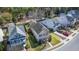 Aerial view of a two-story house with a long driveway and a backyard adjacent to the community pond at 1818 Towne St, Johns Island, SC 29455