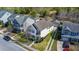Aerial view of a two-story house with blue shutters, green lawn, driveway and neat landscaping at 1818 Towne St, Johns Island, SC 29455