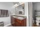 Bathroom with granite countertop, double sinks, and modern fixtures at 1818 Towne St, Johns Island, SC 29455