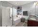 Bright bathroom featuring a separate shower, soaking tub, granite counters, and built in shelving at 1818 Towne St, Johns Island, SC 29455