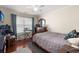Bedroom with hardwood flooring, ceiling fan and natural lighting at 1818 Towne St, Johns Island, SC 29455