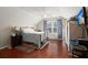 Bedroom with large windows, ceiling fan and hardwood flooring at 1818 Towne St, Johns Island, SC 29455