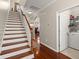 Hallway with stairs and view of the laundry and bedroom at 1818 Towne St, Johns Island, SC 29455