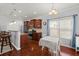 Modern kitchen and dining area featuring stainless steel appliances and granite countertops at 1818 Towne St, Johns Island, SC 29455
