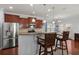 A kitchen with stainless steel appliances, granite countertops, and pendant lighting over a breakfast bar at 1818 Towne St, Johns Island, SC 29455