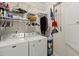 Bright laundry room with ample shelving for storage at 1818 Towne St, Johns Island, SC 29455