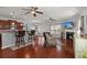 Open-concept living room with bar seating, fireplace, and hardwood floors at 1818 Towne St, Johns Island, SC 29455