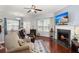 Bright living room with a fireplace, hardwood floors, and comfortable seating at 1818 Towne St, Johns Island, SC 29455