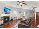 Living room with a fireplace, hardwood floors, and cozy furniture at 1818 Towne St, Johns Island, SC 29455