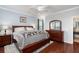 Tranquil main bedroom with wood floors, a ceiling fan, and ample natural light from two windows at 1818 Towne St, Johns Island, SC 29455