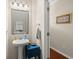 Bright powder room with pedestal sink and stylish fixtures at 1818 Towne St, Johns Island, SC 29455