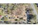 An aerial view of properties surrounded by mature trees, roadways, and neighborhood streets at 1879 Richmond St, Charleston, SC 29407