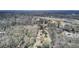 Aerial view of the property showing the tree coverage, buildings, and proximity to roadways at 1879 Richmond St, Charleston, SC 29407