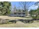 A charming single-story home with a well-manicured lawn and mature trees at 1879 Richmond St, Charleston, SC 29407
