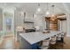 Modern kitchen with a center island, sleek countertops, pendant lighting, and hardwood flooring at 1899 N James Gregarie Rd, Mount Pleasant, SC 29466