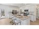 Modern kitchen with granite countertops, stainless steel appliances, and an island with seating at 1039 Swamp Rose Run, Summerville, SC 29485