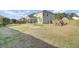 Large fenced backyard with a covered patio and a playset for outdoor enjoyment at 200 Short Woods Ct, Summerville, SC 29486