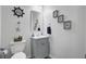 Cozy bathroom with vanity, nautical decorations, wall art, and toilet at 200 Short Woods Ct, Summerville, SC 29486
