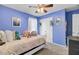 Stylized bedroom boasts plenty of space, colorful decor, and is well lit by a ceiling fan at 200 Short Woods Ct, Summerville, SC 29486