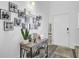 Stylish foyer decor with a decorative table, plant, framed photos, and a welcoming 'Home' sign at 200 Short Woods Ct, Summerville, SC 29486
