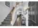 Bright foyer with a staircase, modern flooring, stylish decor, and an open view to the living area at 200 Short Woods Ct, Summerville, SC 29486