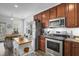 Kitchen with stainless steel appliances, wood cabinets, and an island counter with wooden countertop at 200 Short Woods Ct, Summerville, SC 29486