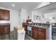 Bright kitchen featuring stainless steel appliances, dark cabinets, and an eat-in counter at 200 Short Woods Ct, Summerville, SC 29486