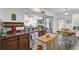 Open floor plan kitchen featuring stainless steel appliances, countertop island, and view into living area at 200 Short Woods Ct, Summerville, SC 29486
