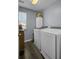 Modern laundry room equipped with a washer, dryer, and window for ample light at 200 Short Woods Ct, Summerville, SC 29486