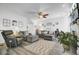 Spacious living room with wood floors, neutral decor, comfortable seating, and a decorative area rug at 200 Short Woods Ct, Summerville, SC 29486