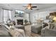 Inviting living room with a fireplace, large screen television, comfortable seating, and an open floor plan at 200 Short Woods Ct, Summerville, SC 29486
