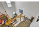 Carpeted staircase with white railing and wooden banister leading to the entry area at 200 Short Woods Ct, Summerville, SC 29486