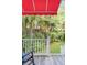 Relaxing backyard view from the deck, featuring tropical trees, a lush garden, and privacy at 21 Limehouse St, Charleston, SC 29401