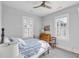 Charming bedroom with blue patterned bedding, complemented by hardwood floors and lots of natural light from two windows at 21 Limehouse St, Charleston, SC 29401