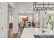Open-concept kitchen offering views of a naturally lit dining room at 21 Limehouse St, Charleston, SC 29401