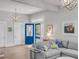 Bright living room featuring a large sectional sofa and a view to the front door at 21 Limehouse St, Charleston, SC 29401