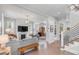 Open-concept living room with hardwood floors, fireplace, and seamless flow to other living spaces at 21 Limehouse St, Charleston, SC 29401