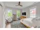 Serene main bedroom with hardwood floors, neutral walls, a ceiling fan, and great natural light at 21 Limehouse St, Charleston, SC 29401