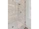 Shower featuring elegant marble tile, modern fixtures, and a glass door, creating a luxurious bathing experience at 21 Limehouse St, Charleston, SC 29401
