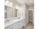 Bright bathroom featuring double vanity with white countertops, tile floors, and neutral walls at 210 Quimby Hill Dr, Huger, SC 29450