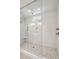 Bright glass shower with white tile and neutral colored floor at 210 Quimby Hill Dr, Huger, SC 29450